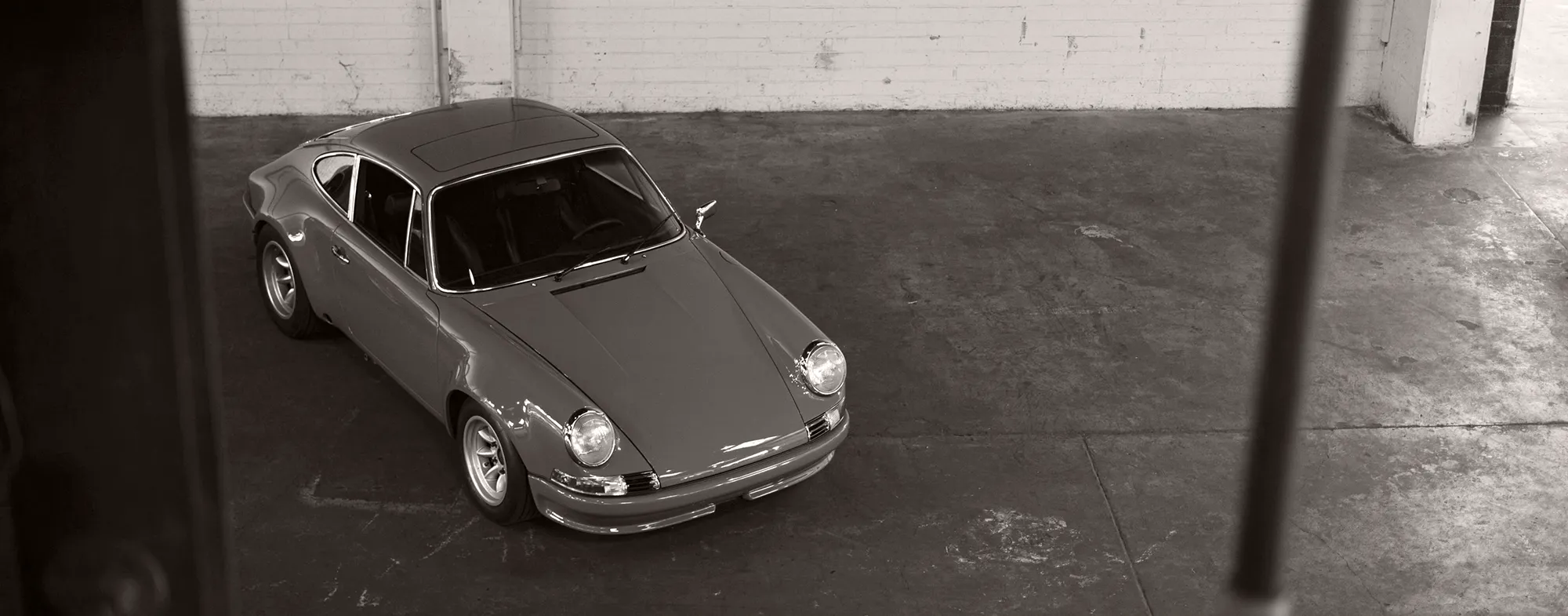 Classic Porsche 911 parked in a private European garage