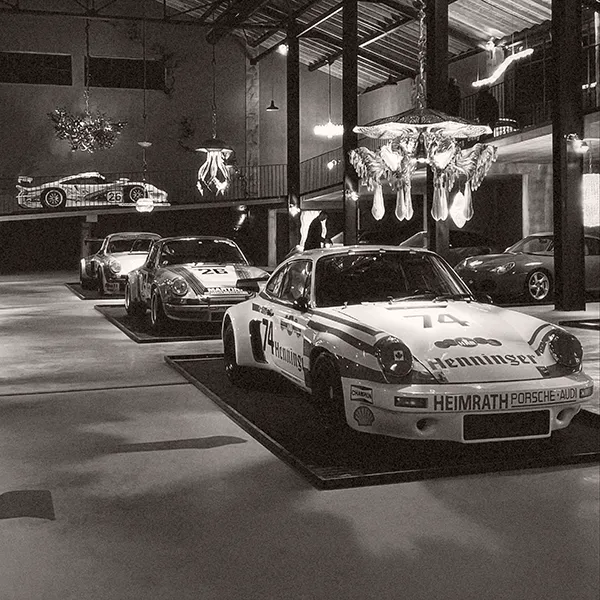 Several Porsche 911s displayed as museum pieces.