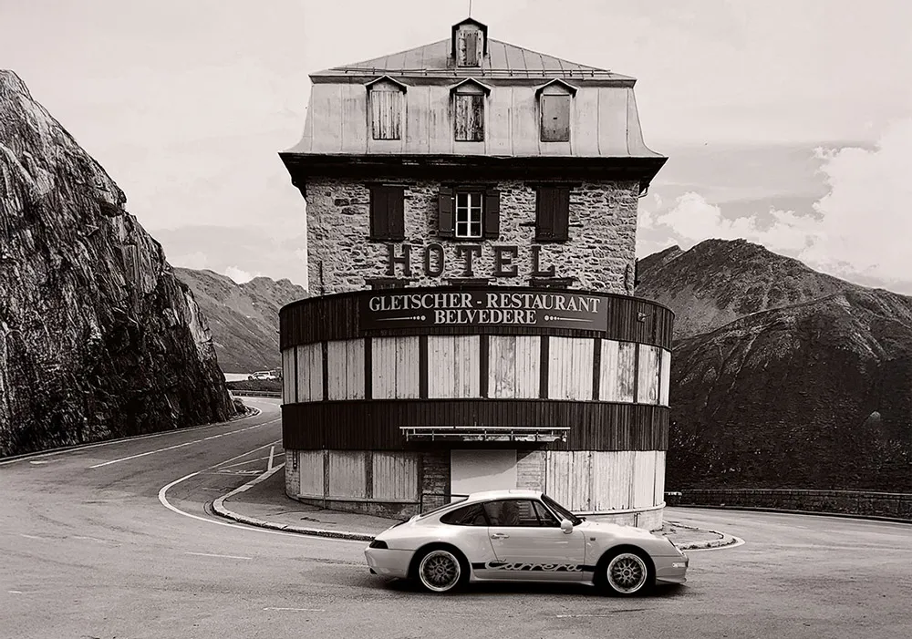 Porsche 911 in front of the Belvedere Hotel, capturing the atmosphere and heritage that inspire THE 911 WAY collectible artworks.