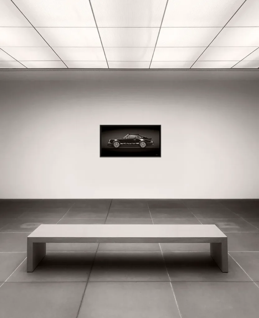 Single automotive artwork displayed in a minimalist gallery space, emphasising restraint, silence, and the power of intentional limitation.